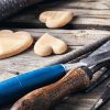 Symbolic wooden hearts cut by hand and carpenter tools